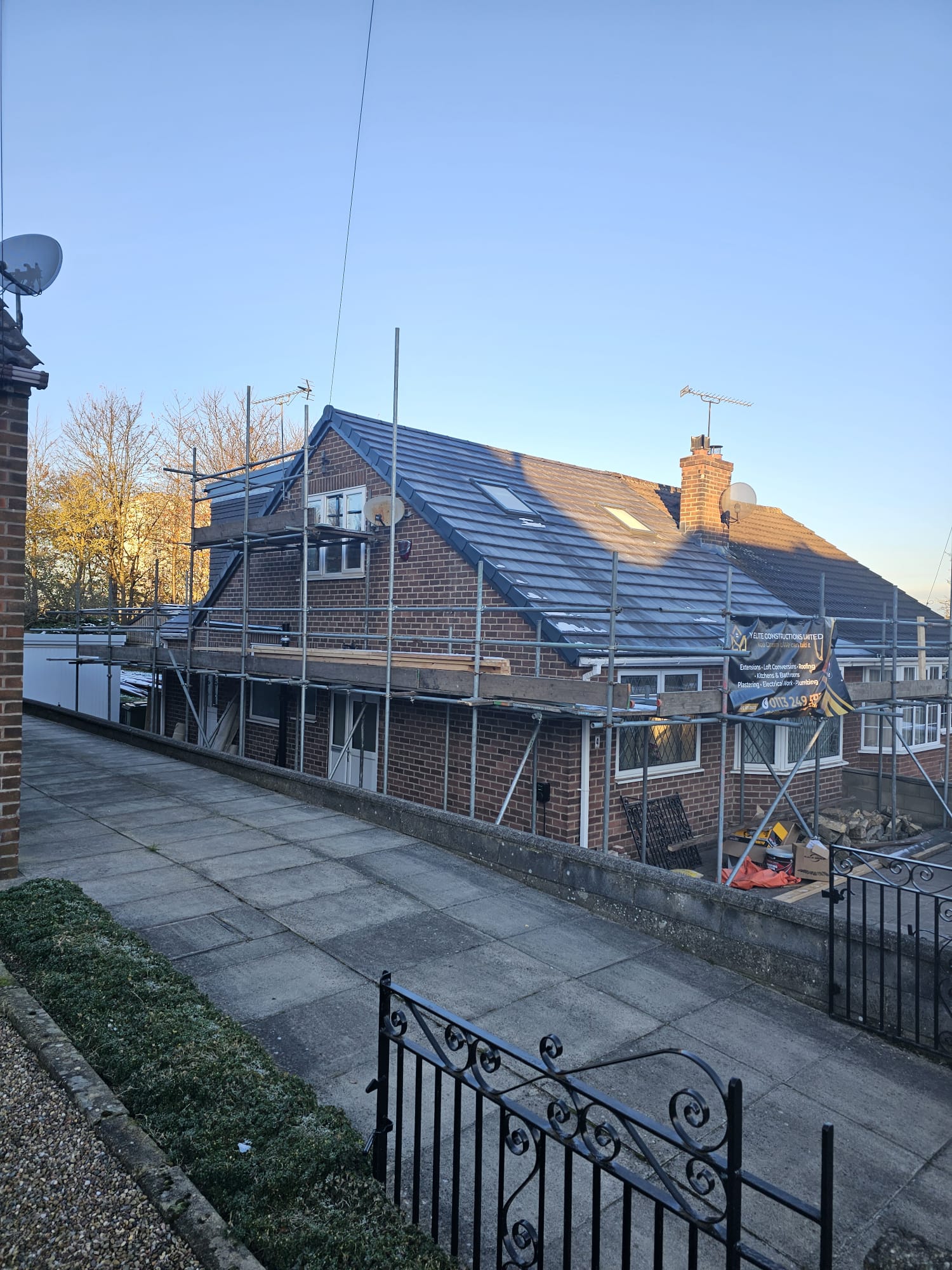 Loft conversion in progress with scaffolding on a Leeds home