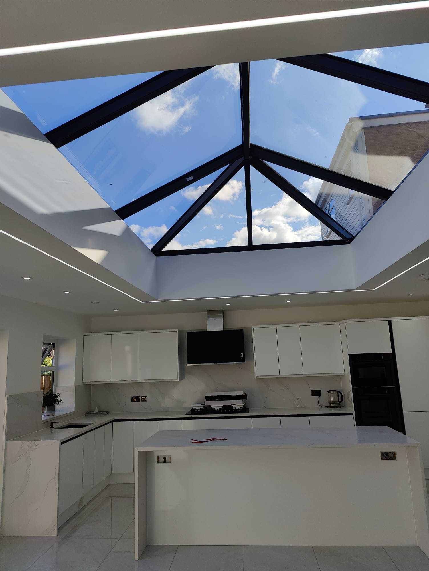 Kitchen extension roof lantern showing blue sky, Leeds kitchen extension