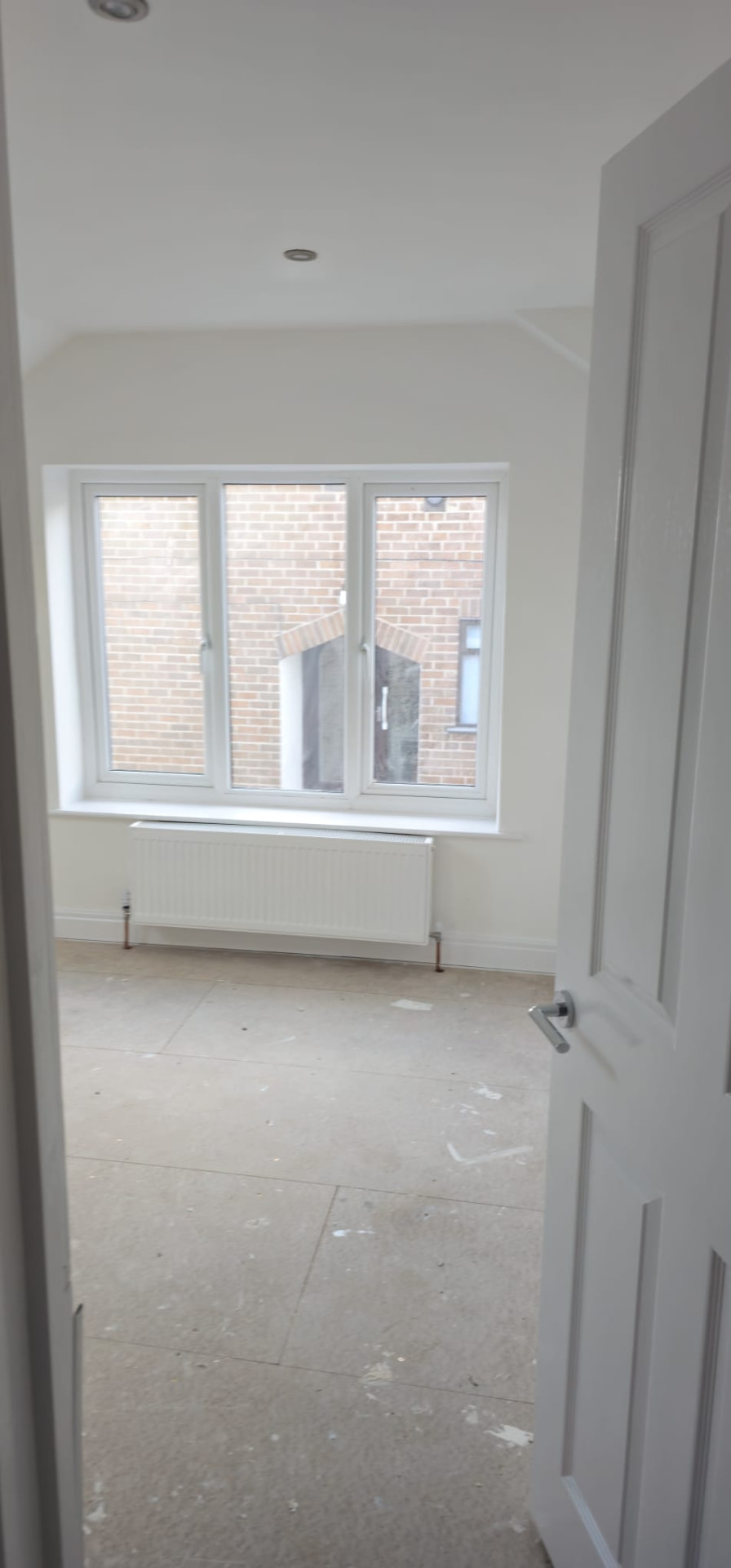 Freshly plastered and painted room in a Leeds home renovation